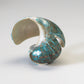 Delvin Leekya: Green Snail Shell, Eagle